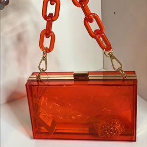 Clear red plastic purse